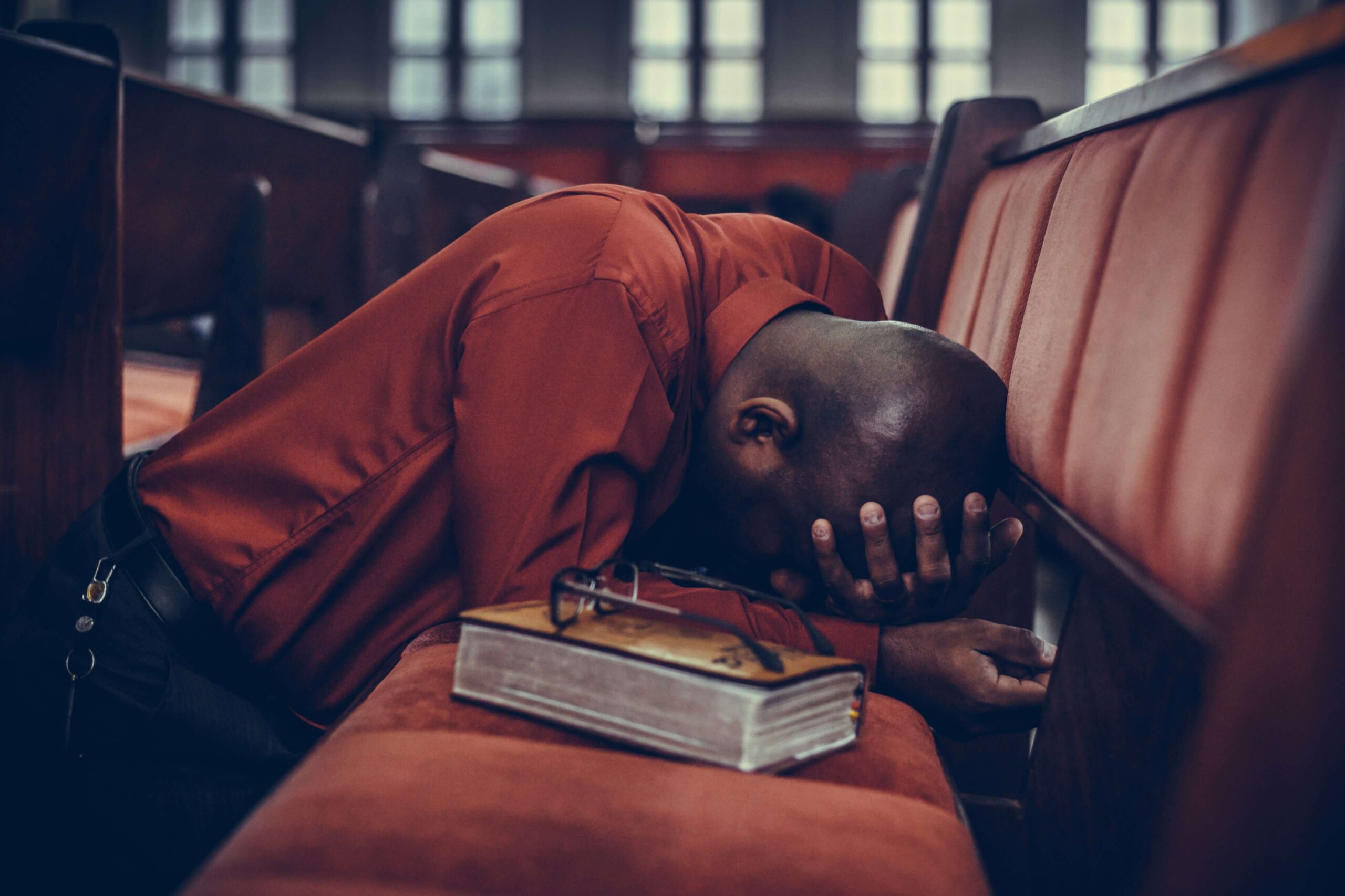 person praying in church